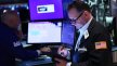 US stocks close higher after Trump signals thaw in trade war
